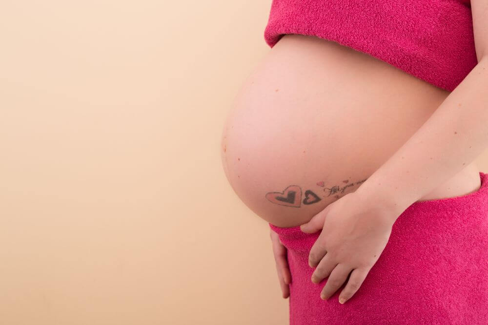 A pregnant client about to have a pregnancy massage at The Tranquility Zone