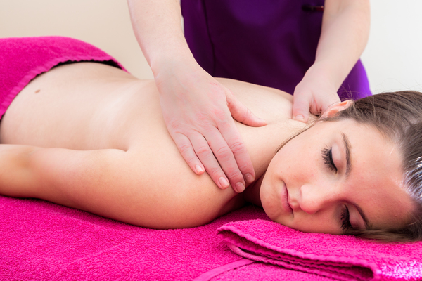 image of client receiving an upper shoulder massage as part of the holistic massage